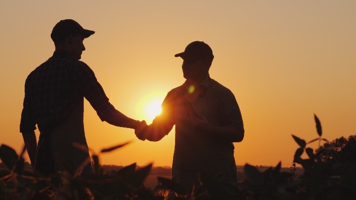 an agricultural sales manager closing a deal